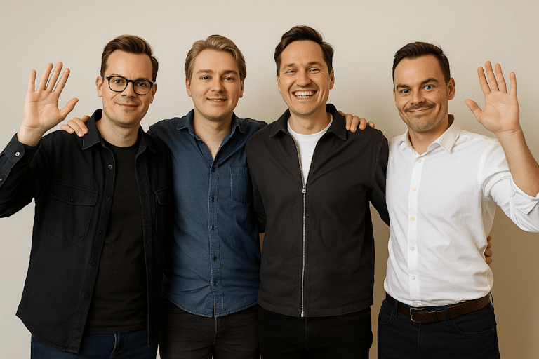 en bild på 4 killar som håller om varandra och vinkar